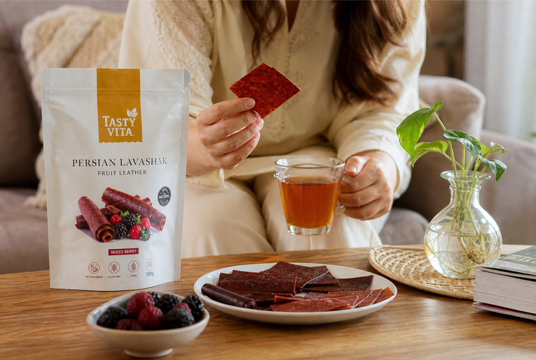 Persian Lavashak fruit leather arranged with healthy dried fruits and tea for natural healthy snacking
