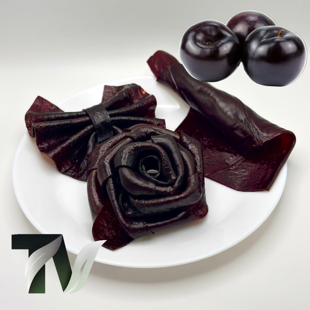Handmade black plum lavashak strips, chewy and naturally sour fruit roll-up