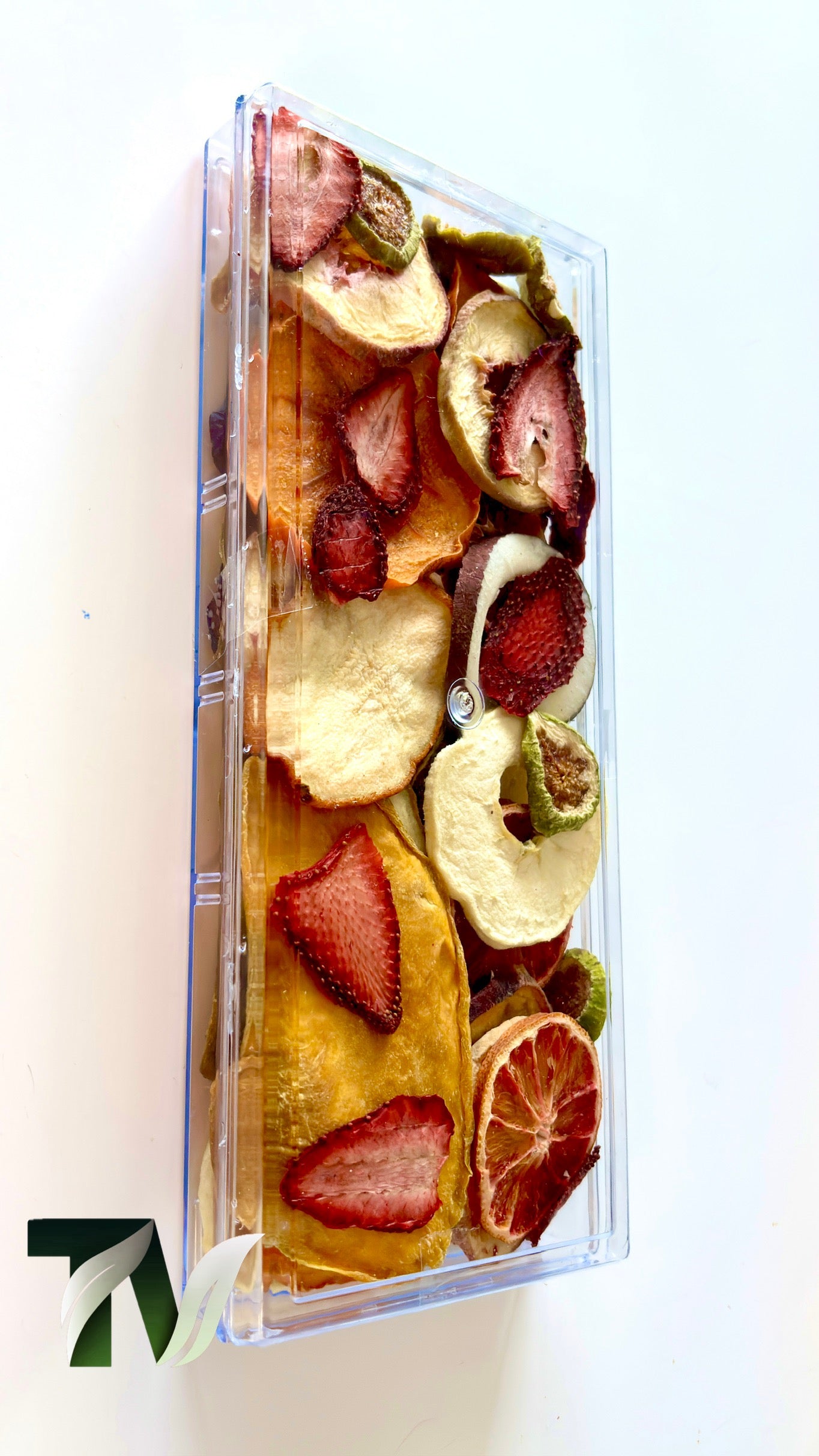Luxury assorted fruit box — premium dried apple, kiwi, orange, and plum in transparent gift container.