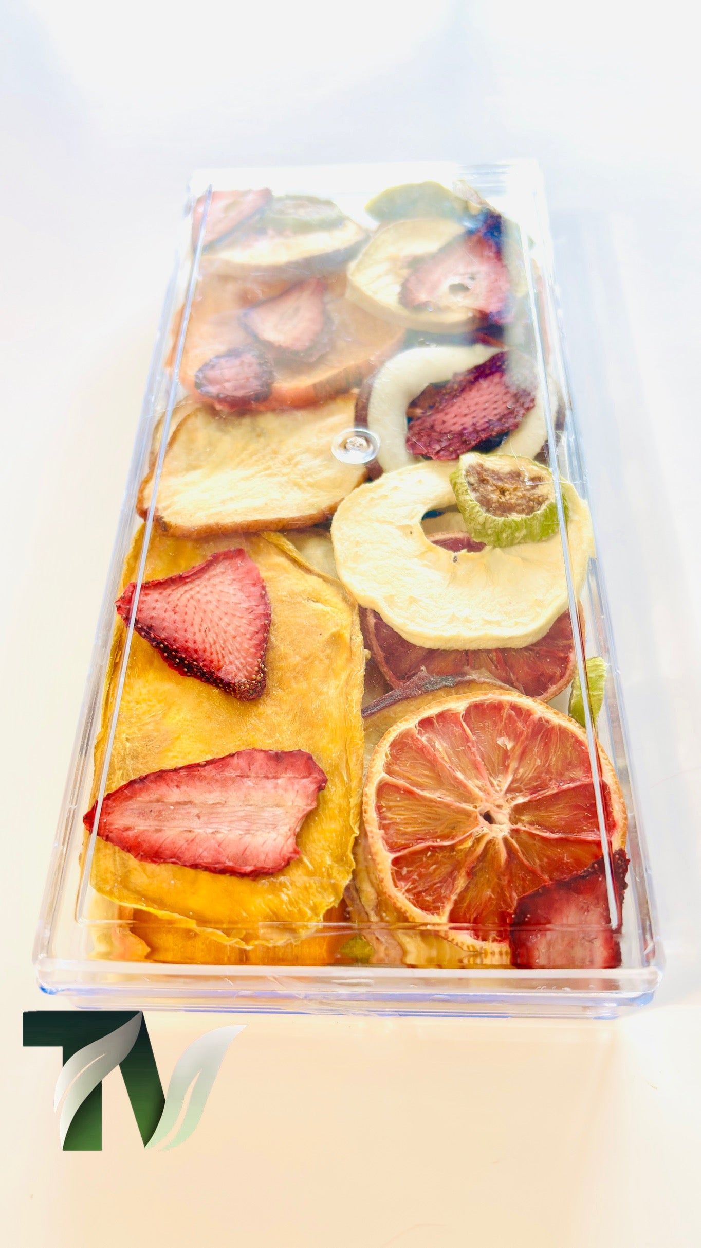 Assorted dried fruits in a premium transparent container — natural, healthy, and beautifully packaged.