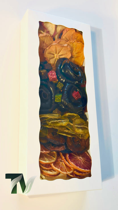 Beautifully arranged dried fruit and Lavashak rose box with mixed natural fruits including orange slices, banana, kiwi, and handcrafted fruit leather roses — perfect healthy vegan gift idea.