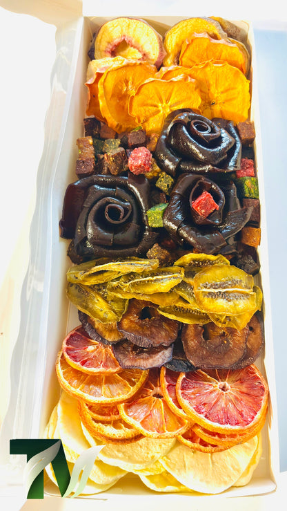 Healthy vegan snack box with rose-shaped fruit rolls and a variety of dried fruits such as kiwi, citrus, and persimmon — no added sugar, perfect for gifting or sharing.