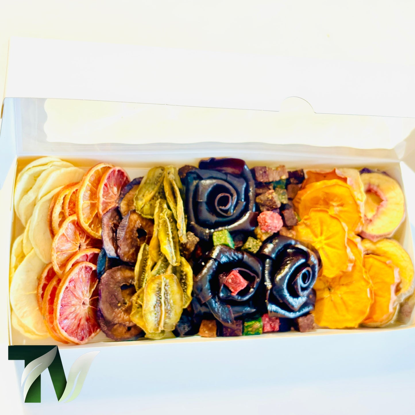 Beautifully arranged dried fruit and Lavashak rose box with mixed natural fruits including orange slices, banana, kiwi, and handcrafted fruit leather roses — perfect healthy vegan gift idea.