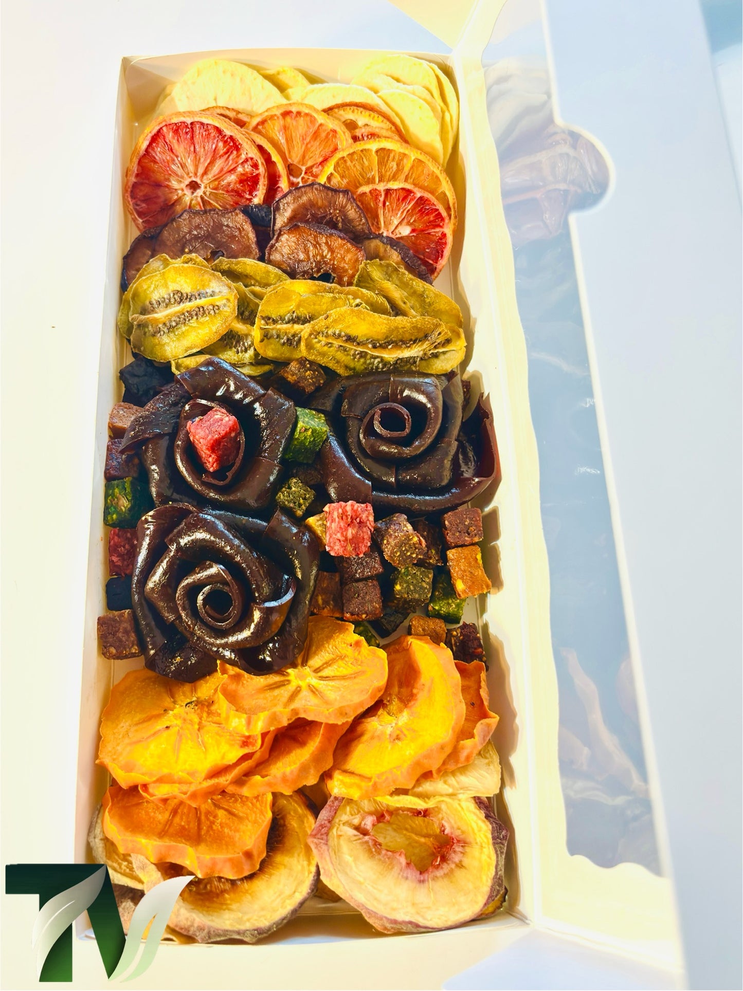 asty Vita premium dried fruit and fruit leather rose assortment, showcasing Persian Lavashak roses, vibrant dried fruits, and colorful fruit cubes in an elegant white gift box.