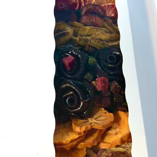 Tasty Vita premium dried fruit and fruit leather rose assortment, showcasing Persian Lavashak roses, vibrant dried fruits, and colorful fruit cubes in an elegant white gift box.