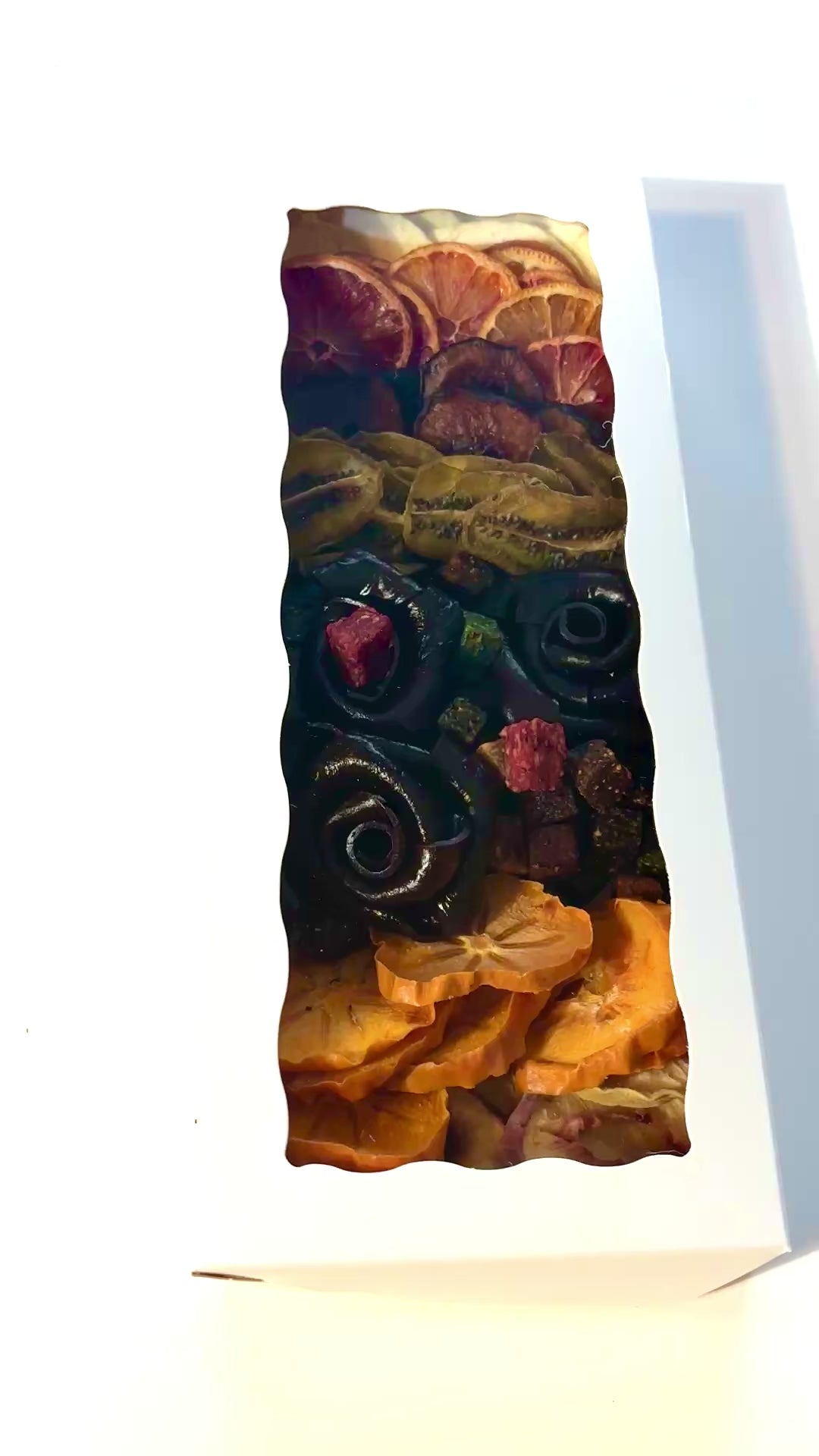 Tasty Vita premium dried fruit and fruit leather rose assortment, showcasing Persian Lavashak roses, vibrant dried fruits, and colorful fruit cubes in an elegant white gift box.